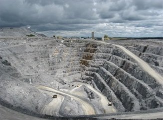 Aerial photo of a surface mine with grey rock