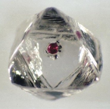 Diamond with a red crystal in the middle