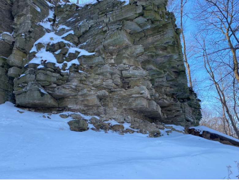 Cliffside in winter showing large angular blocky rocks.
