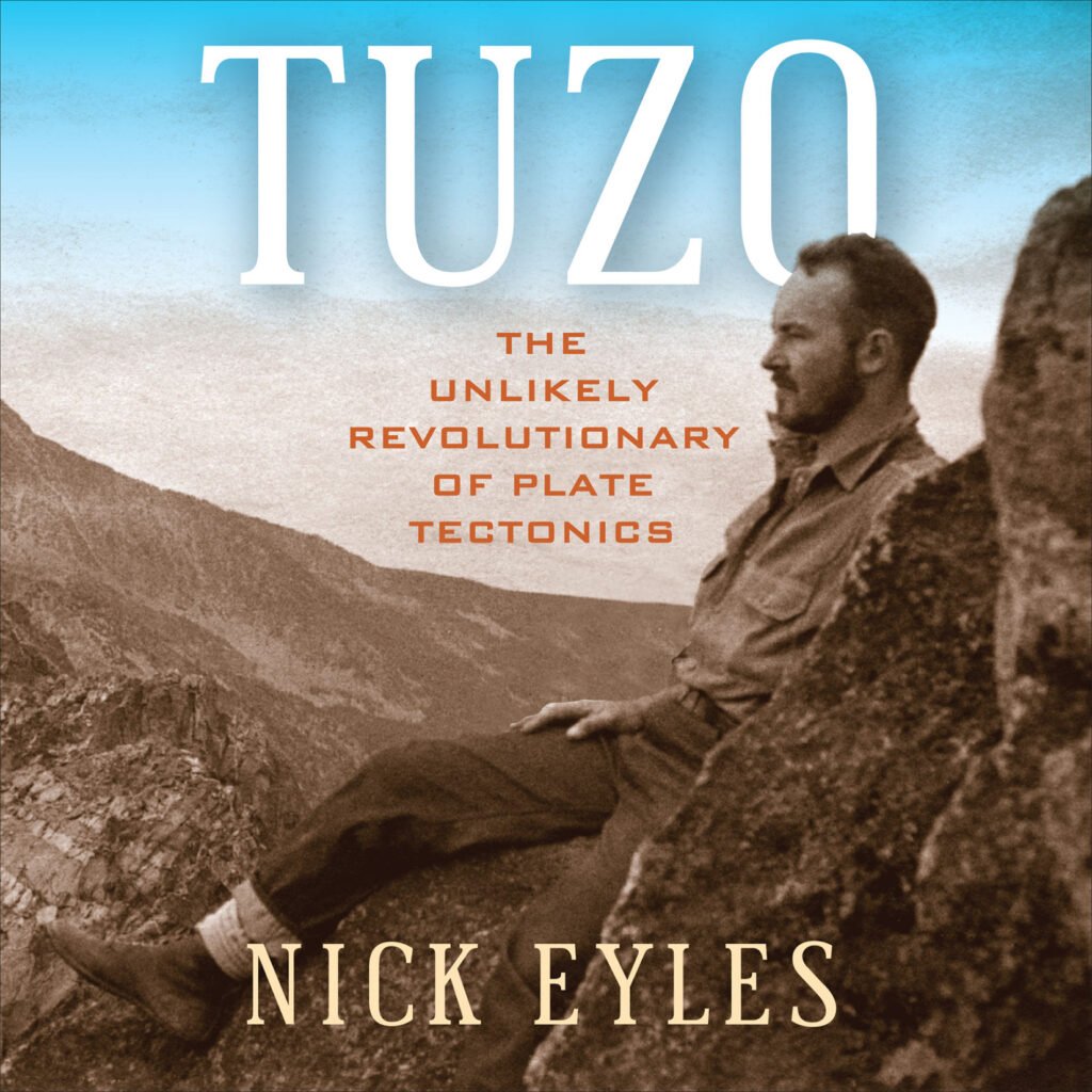 Cover page of a book with a picture of a young John Tuzo Wilson leaning against a rock. Text reads: Tuzo: The unlikely revolutionary of plate tectonics. Nick Eyles."